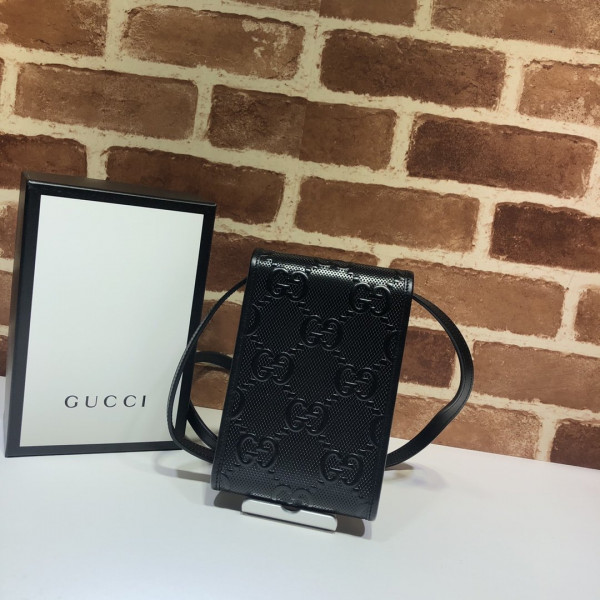 G*u*i gg embossed mini bag