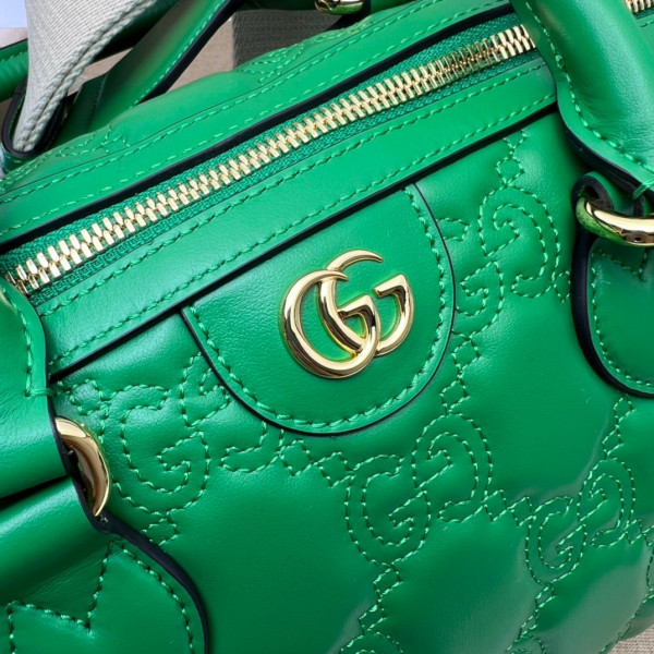 G*u*i gg matelassé leather top handle bag