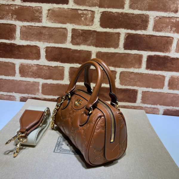 G*u*i gg matelassé leather top handle bag